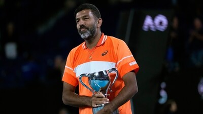 Rohan Bopanna of India holds his trophy after he and partner Matthew Ebden of Australia defeated Simone Bolelli and Andrea Vavassori of Italy in the men's doubles final at the Australian Open tennis championships (AP) Rohan Bopanna of India holds his trophy after he and partner Matthew Ebden of Australia defeated Simone Bolelli and Andrea Vavassori of Italy in the men's doubles final at the Australian Open tennis championships (AP)