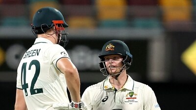 Steve Smith of Australia (R) and teammate Cameron Green confer on day three of the second cricket Test match between Australia and the West Indies at the Gabba in Brisbane (AFP) Steve Smith of Australia (R) and teammate Cameron Green confer on day three of the second cricket Test match between Australia and the West Indies at the Gabba in Brisbane (AFP)