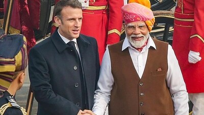 French President Emmanuel Macron being received by Prime Minister Narendra Modi upon his arrival to attend the 75th Republic Day ceremony, in New Delhi (PTI) French President Emmanuel Macron being received by Prime Minister Narendra Modi upon his arrival to attend the 75th Republic Day ceremony, in New Delhi (PTI)