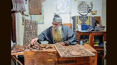 Ghulam Nabi Dar working in his workshop at Danamazar in Srinagar on Friday. (PTI) Ghulam Nabi Dar working in his workshop at Danamazar in Srinagar on Friday. (PTI)