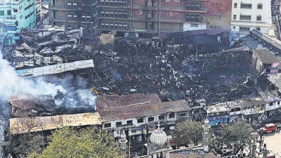 Mumbai, India - Jan. 27, 2024: Workers remove debris from the scene of a fire of Timber Mart on 26th January early morning, at Maulana Shaukat Ali Road, in Mumbai, India, on Saturday, January 27, 2024. (Photo by Anshuman Poyrekar/ Hindustan Times) (Hindustan Times) Mumbai, India - Jan. 27, 2024: Workers remove debris from the scene of a fire of Timber Mart on 26th January early morning, at Maulana Shaukat Ali Road, in Mumbai, India, on Saturday, January 27, 2024. (Photo by Anshuman Poyrekar/ Hindustan Times) (Hindustan Times)