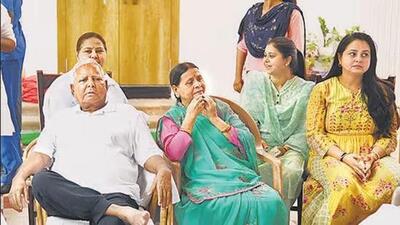 RJD chief Lalu Prasad Yadav with his wife Rabri Devi and daughter Misa Bharti (behind Lalu) in Patna. (File Photo) RJD chief Lalu Prasad Yadav with his wife Rabri Devi and daughter Misa Bharti (behind Lalu) in Patna. (File Photo)