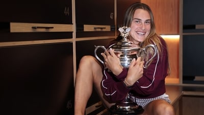 This handout picture released by Tennis Australia on January 27, 2023, shows Belarus' Aryna Sabalenka poses with the 2024 Australian Open women's singles final trophy at the locker room in Melbourne (AFP) This handout picture released by Tennis Australia on January 27, 2023, shows Belarus' Aryna Sabalenka poses with the 2024 Australian Open women's singles final trophy at the locker room in Melbourne (AFP)