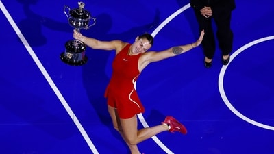 Belarus' Aryna Sabalenka poses with the trophy after winning the final against China's Qinwen Zheng (REUTERS)