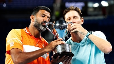 India's Rohan Bopanna and Australia's Matthew Ebden celebrate with the trophy after winning the men's doubles final against Italy's Simone Bolelli and Andrea Vavassori (REUTERS)