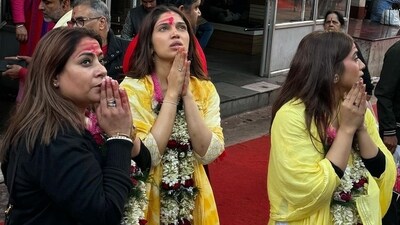 Bhumi Pednekar and Samiksha Pednekar were accompanied by others as well and posed for pictures with garlands around their neck and the red tilak on their forehead.&nbsp; 