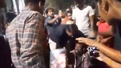 The accused caught by students and security guards at the women's hostel at Osmania University in Hyderabad. (Screengrab / X)