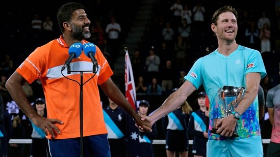 Rohan Bopanna, left, of India and Matthew Ebden of Australia react after receiving their trophy. (AP)