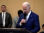 President Joe Biden bows his head in a moment of silence for the three American troops killed on Sunday.