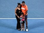 India's Rohan Bopanna poses with his family after victory against Italy's Simone Bolelli and Andrea Vavassori