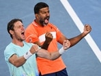 Rohan Bopanna (R) and Australia's Matthew Ebden celebrate after victory against Italy's Simone Bolelli and Andrea Vavassori during their men's doubles final match on day 14 of the Australian Open tennis tournament in Melbourne on January 27, 2024