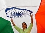 Workers give finishing touches to an Indian flag at a workshop ahead of the Republic Day, in Mumbai on Wednesday. (HT PHOTO) Workers give finishing touches to an Indian flag at a workshop ahead of the Republic Day, in Mumbai on Wednesday. (HT PHOTO)