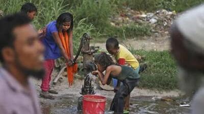 In this Tuesday, Sept. 12, 2017 photo, a young Rohingya refugee girl drinks water from a ground water pump at a camp for the refugees in New Delhi, India. Rohingya in India face an uncertain future, with the Hindu-nationalist government threatening to deport them back to Myanmar. There are some 40,000 Rohingya living in clusters around the country. But only 16,500 have been registered with the U.N. refugee agency. (AP Photo/Altaf Qadri) (AP)