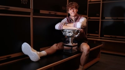 This handout picture released by Tennis Australia on January 29, 2024, shows Italy's Jannik Sinner poses with the 2024 Australian Open men's singles final trophy at the locker room in (AFP) This handout picture released by Tennis Australia on January 29, 2024, shows Italy's Jannik Sinner poses with the 2024 Australian Open men's singles final trophy at the locker room in (AFP)