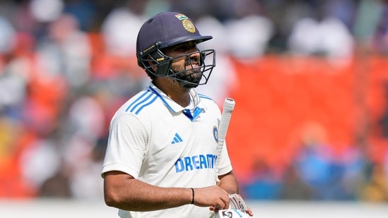 India's captain Rohit Sharma reacts as he leaves the field after losing his wicket to England's Tom Hartley on the fourth day of the first cricket test match between England and India (AP)