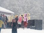 Tourists are seen enjoying snowfall at Gulmarg in Kashmir, India. Snowfall rescues tourism in Kashmir, tourists flock to Gulmarg and Sonamarg 