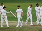 England's Ben Stokes celebrates with Ollie Pope and teammates after winning the first Test match