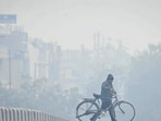 Commuters seen out on a cold and foggy day at JLN Stadium in New Delhi, India. (Hindustan Times) Commuters seen out on a cold and foggy day at JLN Stadium in New Delhi, India. (Hindustan Times)