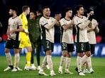 Paris St Germain's Kylian Mbappe and Marquinhos applaud fans after the match