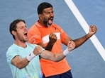 India's Rohan Bopanna (R) and Australia's Matthew Ebden celebrate after victory against Italy's Simone Bolelli and Andrea Vavassori during their men's doubles final match on day 14 of the Australian Open.