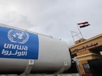 A truck, marked with United Nations Relief and Works Agency (UNRWA) logo, crosses into Egypt from Gaza.