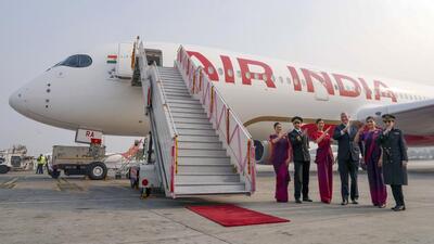 Air India CEO and MD Campbell Wilson with cabin and cockpit crew in New Delhi on December 23. (PTI Photo)