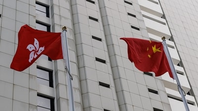 Chinese and Hong Kong flags are seen outside the High Court in Hong Kong, China. (Reuters/File)