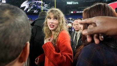 Taylor Swift speaks with people on the field after an AFC Championship NFL football game between the Baltimore Ravens and the Kansas City Chiefs, Sunday, Jan. 28, 2024, in Baltimore. The Kansas City Chiefs won 17-10. (AP Photo/Alex Brandon) (AP) Taylor Swift speaks with people on the field after an AFC Championship NFL football game between the Baltimore Ravens and the Kansas City Chiefs, Sunday, Jan. 28, 2024, in Baltimore. The Kansas City Chiefs won 17-10. (AP Photo/Alex Brandon) (AP)