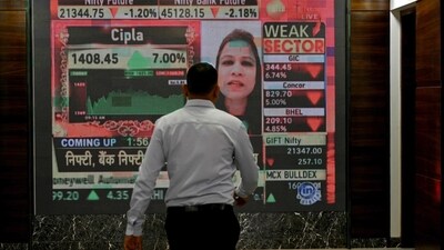 A man walks past a digital display inside the Bombay Stock Exchange (BSE) building in Mumbai. (AFP) A man walks past a digital display inside the Bombay Stock Exchange (BSE) building in Mumbai. (AFP)