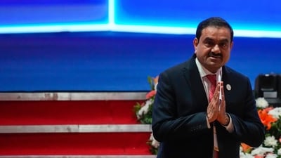 India's Adani Group chairman Gautam Adani leaves after addressing the Vibrant Gujarat Global Summit. (AP) India's Adani Group chairman Gautam Adani leaves after addressing the Vibrant Gujarat Global Summit. (AP)