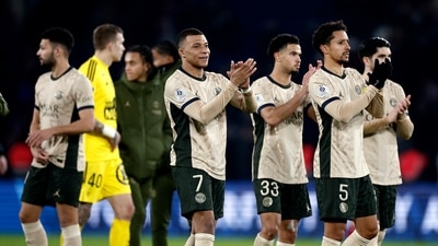 Paris St Germain's Kylian Mbappe and Marquinhos applaud fans after the match (REUTERS)