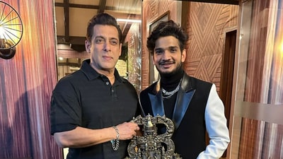 Munawar Faruqui with Bigg Boss host Salman Khan after the finale show. Munawar Faruqui with Bigg Boss host Salman Khan after the finale show.