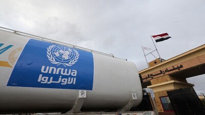 A truck, marked with United Nations Relief and Works Agency (UNRWA) logo, crosses into Egypt from Gaza. (Reuters)