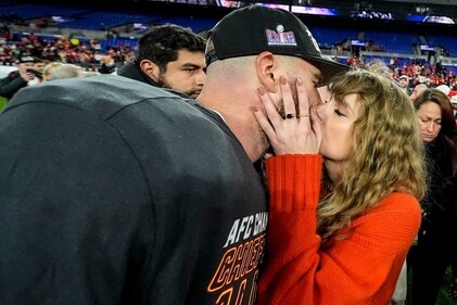 Taylor Swift kisses Kansas City Chiefs tight end Travis Kelce after an AFC Championship NFL football game against the Baltimore Ravens, Sunday, Jan. 28, 2024, in Baltimore. The Kansas City Chiefs won 17-10. (AP)