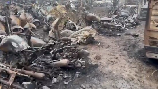 Charred vehicles at the Wazirbad police yard (ANI)