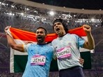 Indian athletes Neeraj Chopra and Kishore Kumar Jena celebrate after securing gold and silver medals respectively in the Men's Javelin Throw Final event at the 19th Asian Games