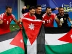 Jordan's Yazan Al Arab, Ehsan Haddad and teammates celebrate after the match
