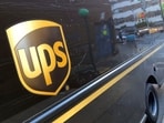FILE - A United Parcel Service truck is parked on a street, in New York, Thursday, May 11, 2023.  Shares of UPS are falling before the market open on Tuesday, Jan. 30, 2024,  as the package delivery company gave a weaker-than-expected full-year revenue forecast. (AP Photo/Richard Drew, File)