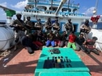 Indian Navy commandos with Somali pirates. Indian Navy commandos with Somali pirates.