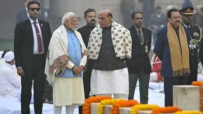 PM Modi talks to Defence Minister Rajnath Singh as they pay homage at the Mahatma Gandhi memorial at Rajghat on Gandhi's death anniversary in New Delhi. (AFP) PM Modi talks to Defence Minister Rajnath Singh as they pay homage at the Mahatma Gandhi memorial at Rajghat on Gandhi's death anniversary in New Delhi. (AFP)