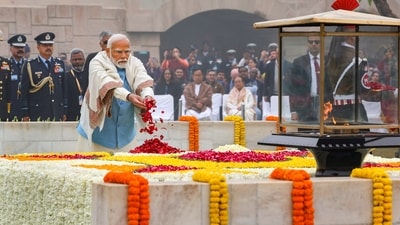 Prime Minister Narendra Modi, President Droupani Murmu and other leaders and dignitaries on Tuesday paid tribute to Mahatma Gandhi on his 76th death anniversary at Rajghat in Delhi. (PTI) Prime Minister Narendra Modi, President Droupani Murmu and other leaders and dignitaries on Tuesday paid tribute to Mahatma Gandhi on his 76th death anniversary at Rajghat in Delhi. (PTI)
