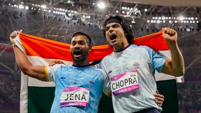 Indian athletes Neeraj Chopra and Kishore Kumar Jena celebrate after securing gold and silver medals respectively in the Men's Javelin Throw Final event at the 19th Asian Games (PTI) Indian athletes Neeraj Chopra and Kishore Kumar Jena celebrate after securing gold and silver medals respectively in the Men's Javelin Throw Final event at the 19th Asian Games (PTI)
