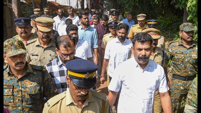 Police escort PFI workers after the sentencing in Alappuzha on Tuesday. (PTI) Police escort PFI workers after the sentencing in Alappuzha on Tuesday. (PTI)