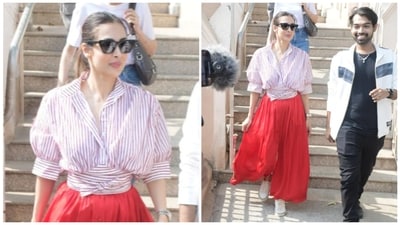 Malaika Arora visited the Mount Mary Church in Mumbai on Tuesday. She was spotted in a striped white shirt and red skirt. She is a yoga enthusiast and has her yoga studio. Malaika Arora visited the Mount Mary Church in Mumbai on Tuesday. She was spotted in a striped white shirt and red skirt. She is a yoga enthusiast and has her yoga studio.
