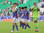 Japan's players greet their supporters after the Qatar 2023 AFC Asian Cup football match against Bahrain