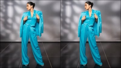 Rashmika's outfit is from the shelves of clothing brand Alice and Olivia and features a V-neck waistcoat, which she teamed with a bright cyan oversized blazer and loose-fitting trousers. With the perfect blend of style and grace, her outfit is a complete showstopper. (Instagram/@rashmika_mandanna) Rashmika's outfit is from the shelves of clothing brand Alice and Olivia and features a V-neck waistcoat, which she teamed with a bright cyan oversized blazer and loose-fitting trousers. With the perfect blend of style and grace, her outfit is a complete showstopper. (Instagram/@rashmika_mandanna)