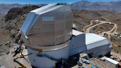Aerial view of Vera C. Rubin Observatory located in the Pachon hill, approximately 80 km from the city of La Serena, in the Coquimbo Region, Chile, taken on January 24, 2024. Surrounded by desert-like mountains and under the blue skies of northern Chile, the Vera C. Rubin Observatory will revolutionize the study of the universe when it incorporates the largest digital camera ever built in the world. (AFP) Aerial view of Vera C. Rubin Observatory located in the Pachon hill, approximately 80 km from the city of La Serena, in the Coquimbo Region, Chile, taken on January 24, 2024. Surrounded by desert-like mountains and under the blue skies of northern Chile, the Vera C. Rubin Observatory will revolutionize the study of the universe when it incorporates the largest digital camera ever built in the world. (AFP)