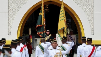 The incoming 17th King of Malaysia, the Sultan of Johor, Sultan Ibrahim Sultan Iskandar observes the guard of honour at the National Palace in Kuala Lumpur, Malaysia. (Reuters)