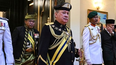 New Malaysian King Sultan Ibrahim Iskandar, front center, walks out after the oath taking ceremony at the National Palace in Kuala Lumpur Wednesday (AP) New Malaysian King Sultan Ibrahim Iskandar, front center, walks out after the oath taking ceremony at the National Palace in Kuala Lumpur Wednesday (AP)