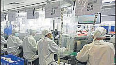 Noida, India - June 07, 2021: Factory workers at a mobile manufacturing unit seen at work on Day 1 of Covid-19 lockdown relaxations in the district, in Noida, India, on Monday, June 07, 2021. (Photo by Sunil Ghosh / Hindustan Times)